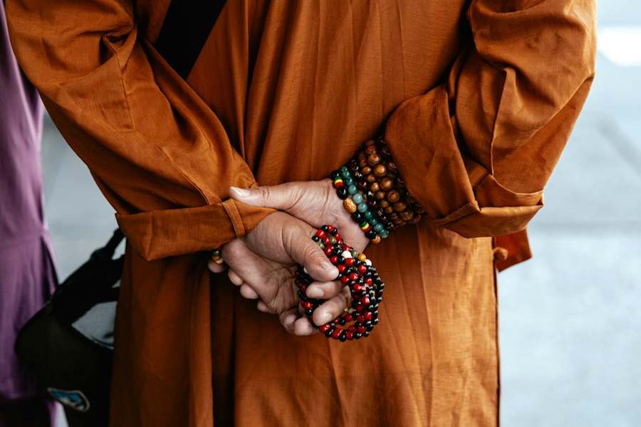 Hands holding mala prayer beads